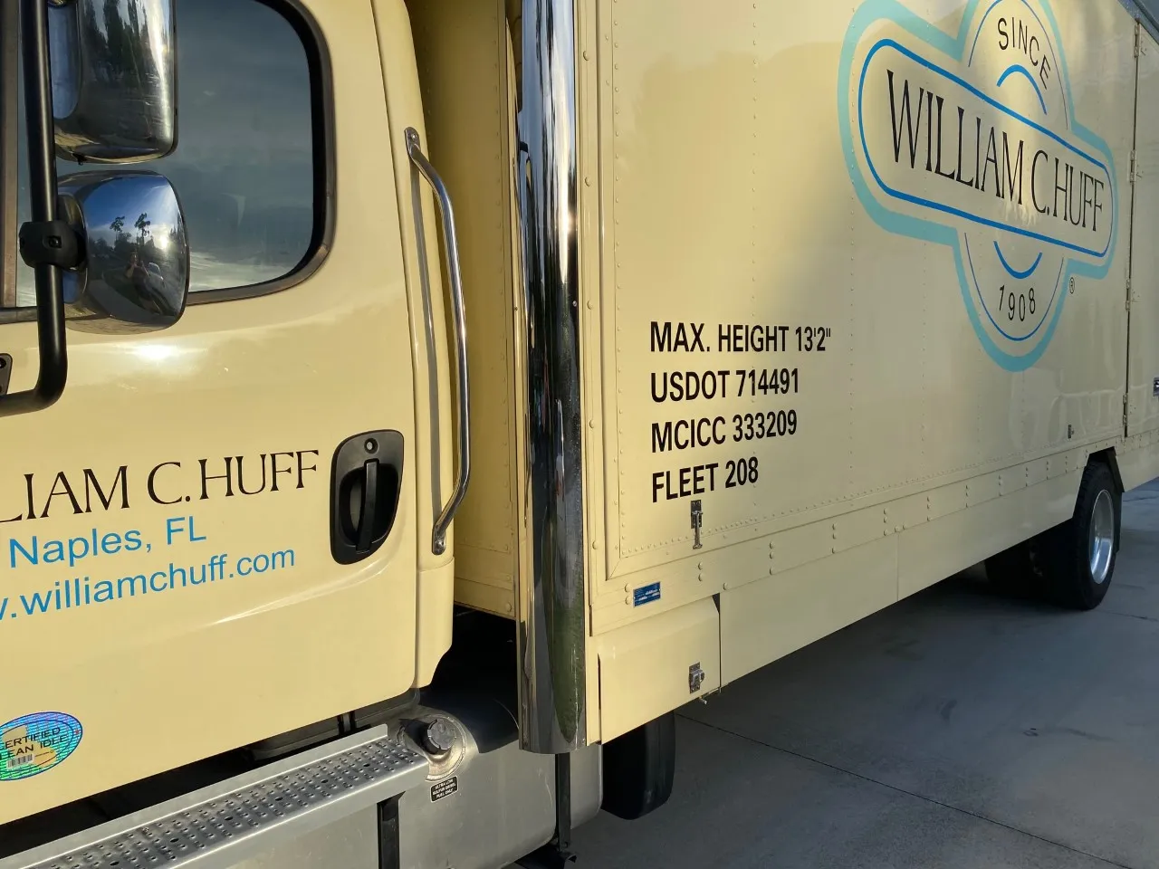 A William C. Huff moving truck displaying USDOT and MCICC registration numbers, highlighting a licensed and insured moving company