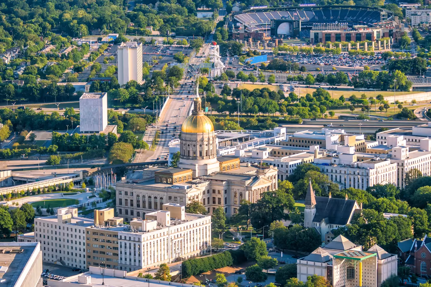 Aerial view of the gold-domed Georgia State Capitol building in downtown Atlanta