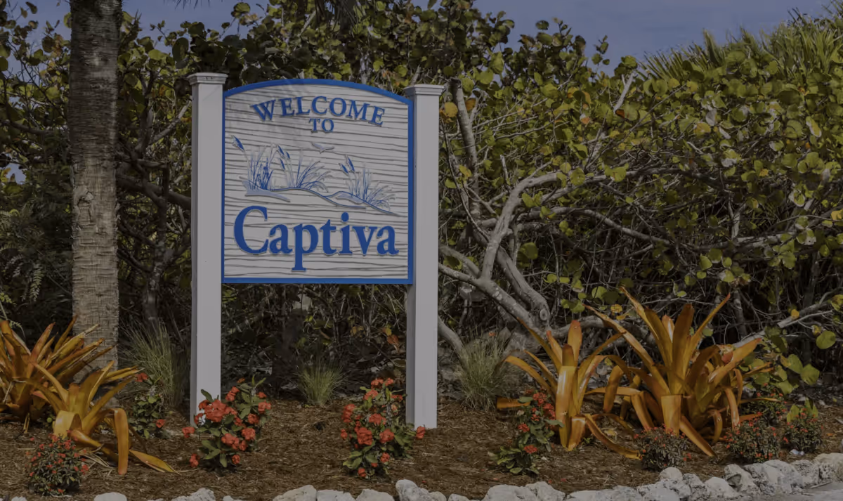 Welcome to Captiva sign surrounded by tropical greenery and flowers
