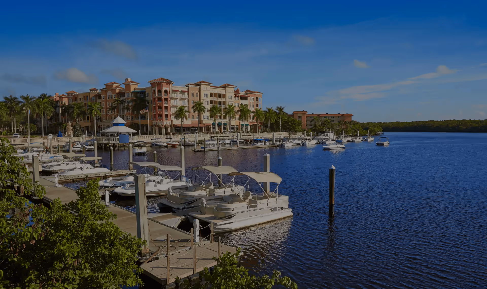 Aerial view of luxury waterfront estates and private docks in the Port Royal neighborhood of Naples, Florida