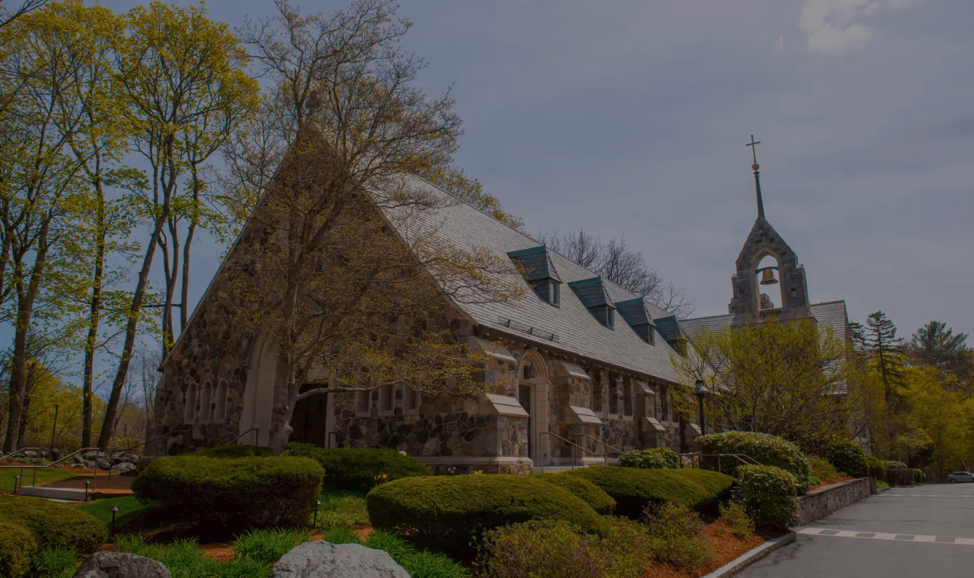 Exterior view of the stone St. Peter's Episcopal Church in Weston, Massachusetts