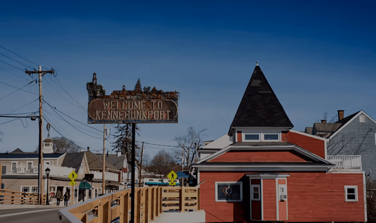 Scenic harbor view with sailboats and historic buildings along the waterfront in Kennebunkport, Maine