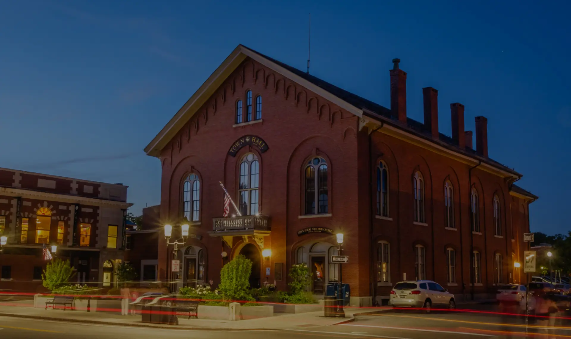 Historic brick Town Hall building illuminated at dusk in Andover, Massachusetts