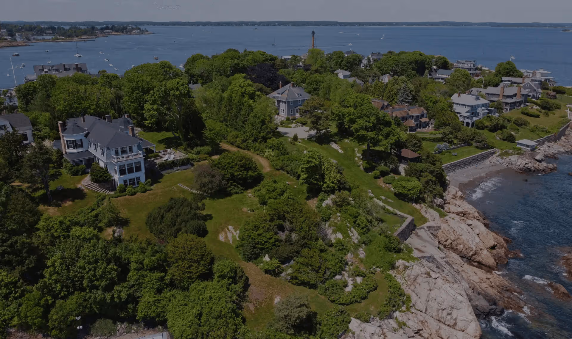 Aerial view of the rocky coastline and blue waters of Marblehead, Massachusetts