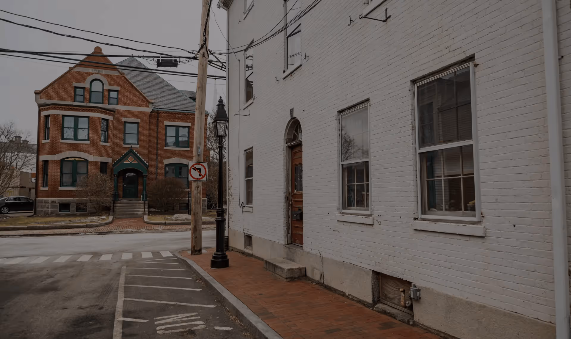 Street view of historic brick and white buildings in Newburyport