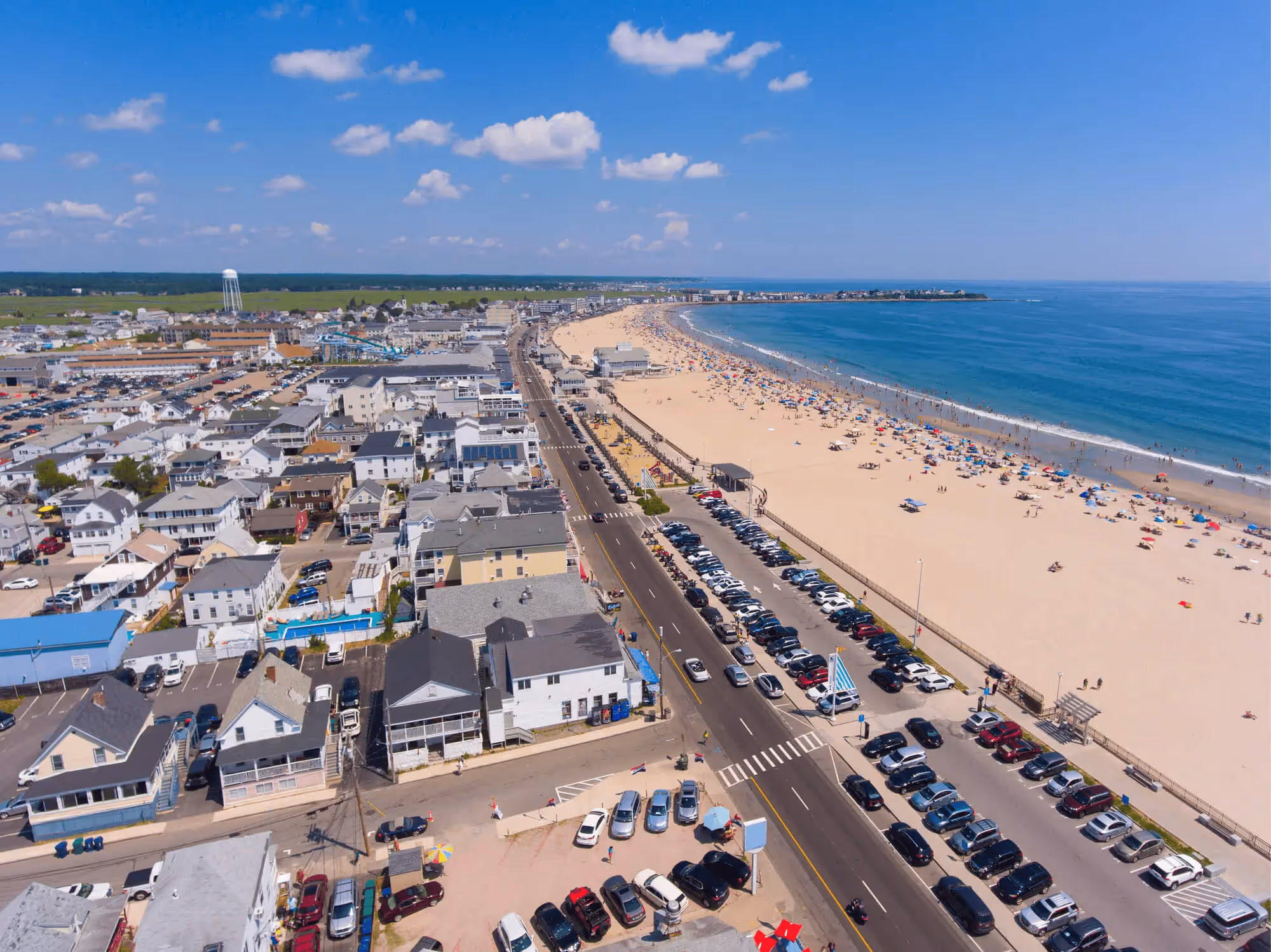 Aerial drone view of Hampton Beach, New Hampshire, featuring the coastline, sandy beach, and oceanfront buildings