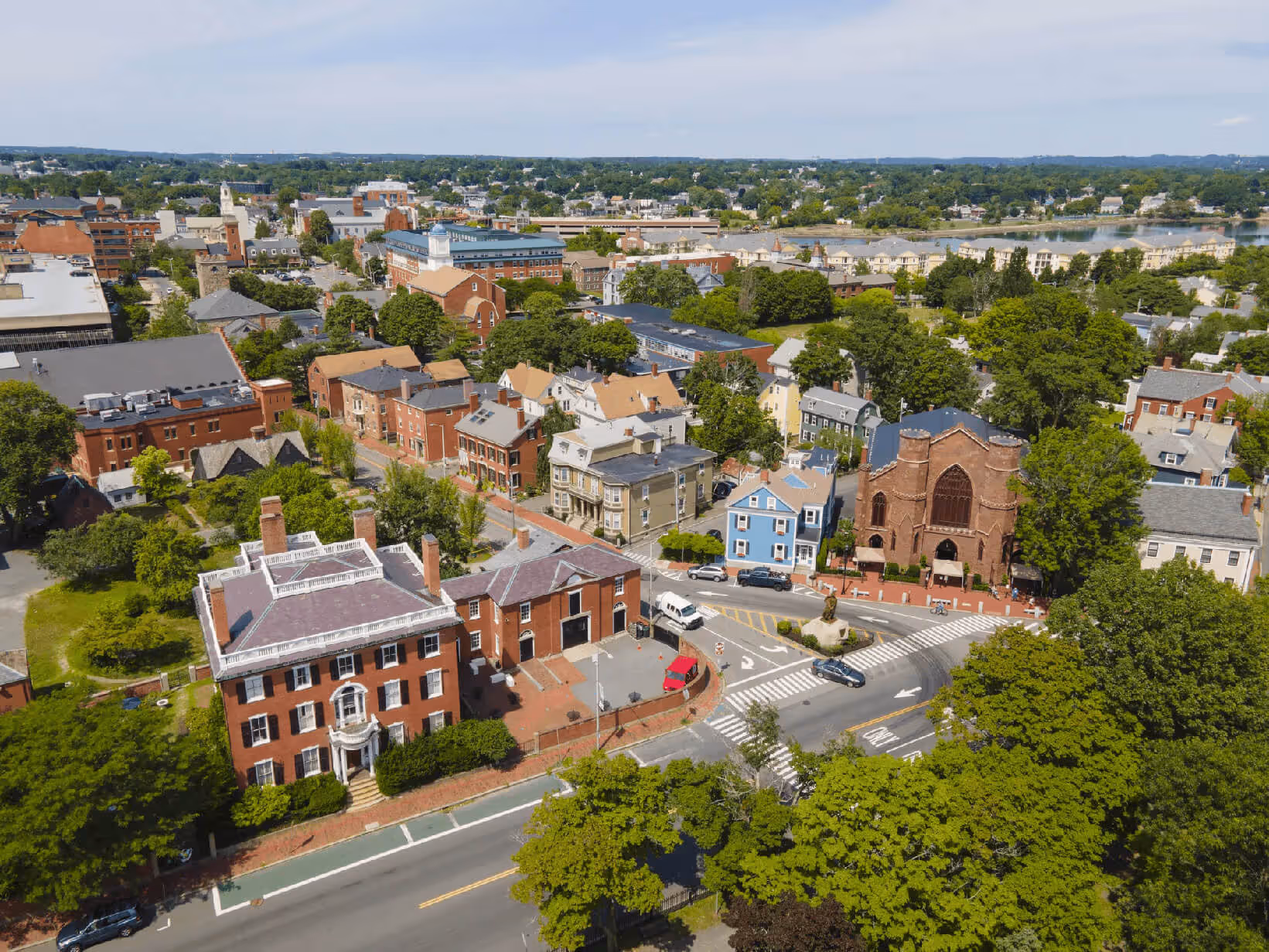 Aerial landscape of Salem, New Hampshire, showing suburban residential areas nestled among colorful autumn trees
