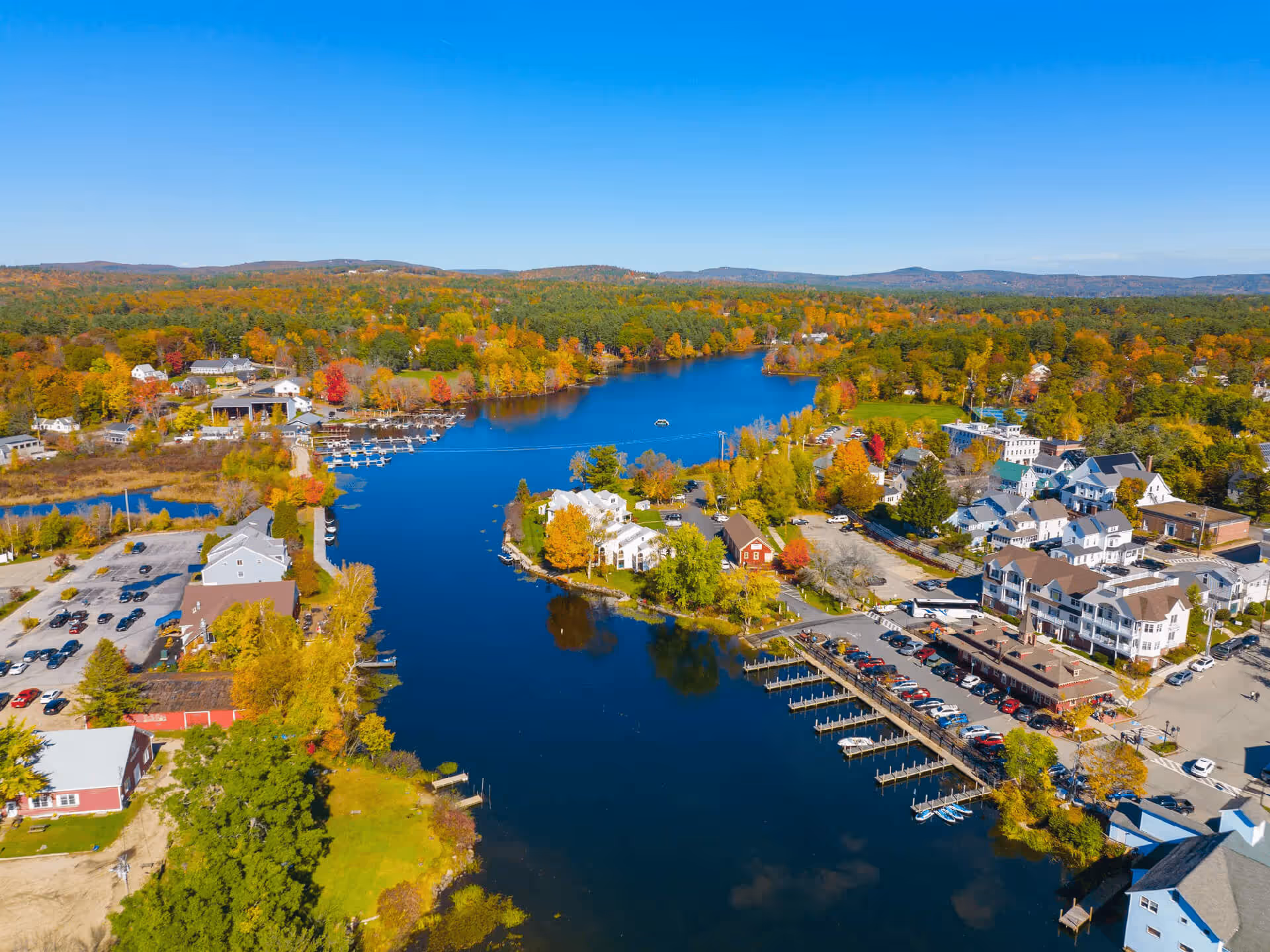 Aerial drone shot of the Wolfeboro, New Hampshire waterfront and town center on Lake Winnipesaukee