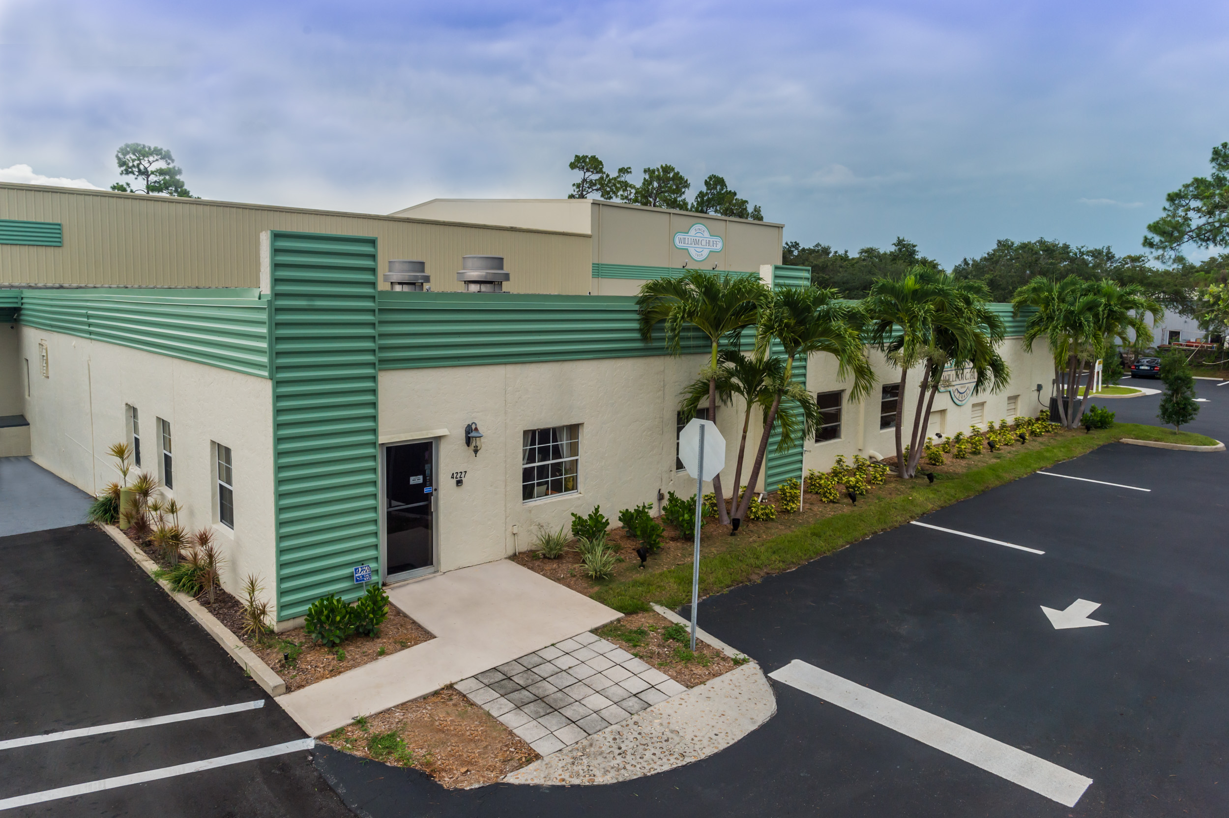 Exterior view of the William Huff commercial building and parking lot in Florid