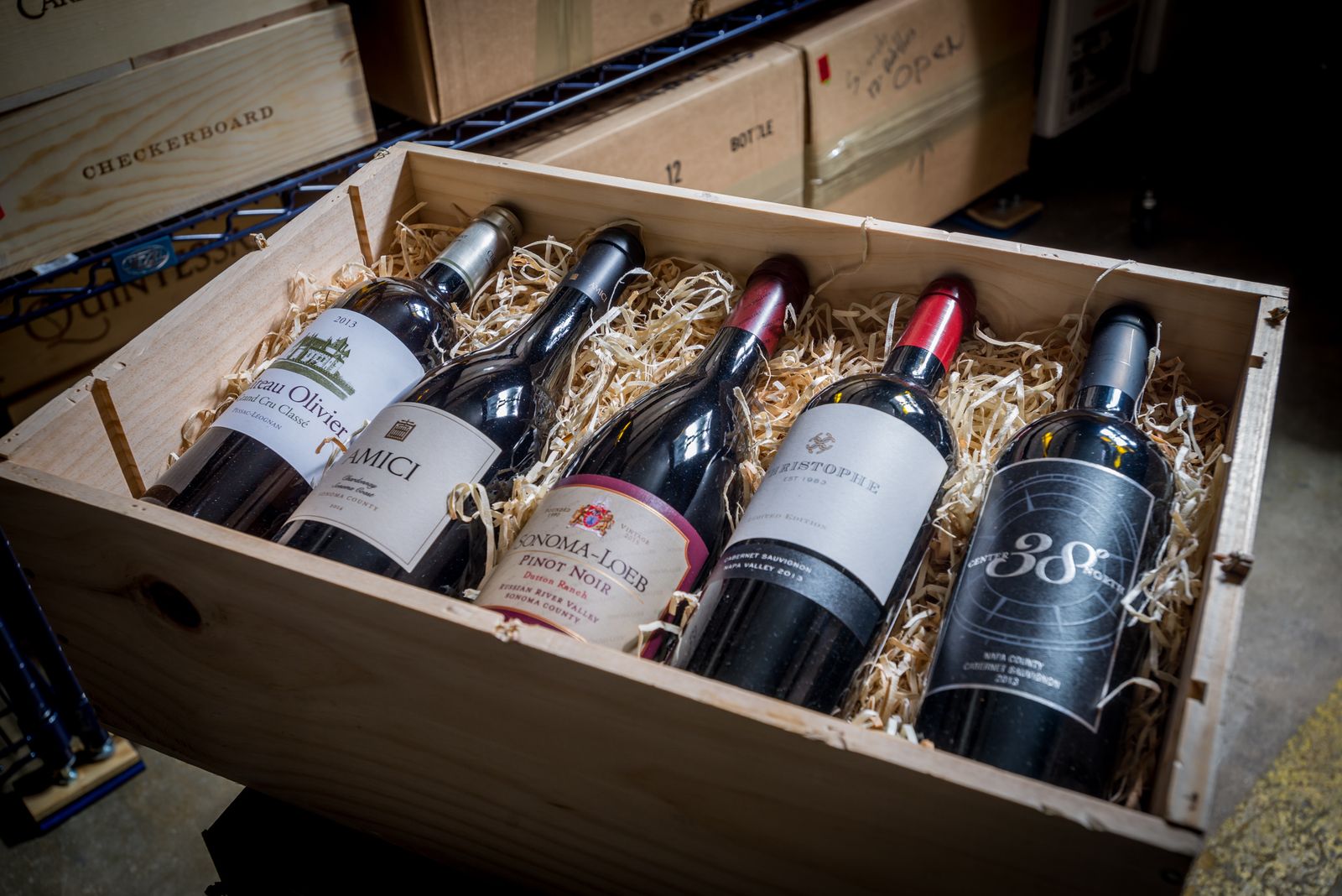 Fine wine packed in a wooden crate for transport to a receiving cellar