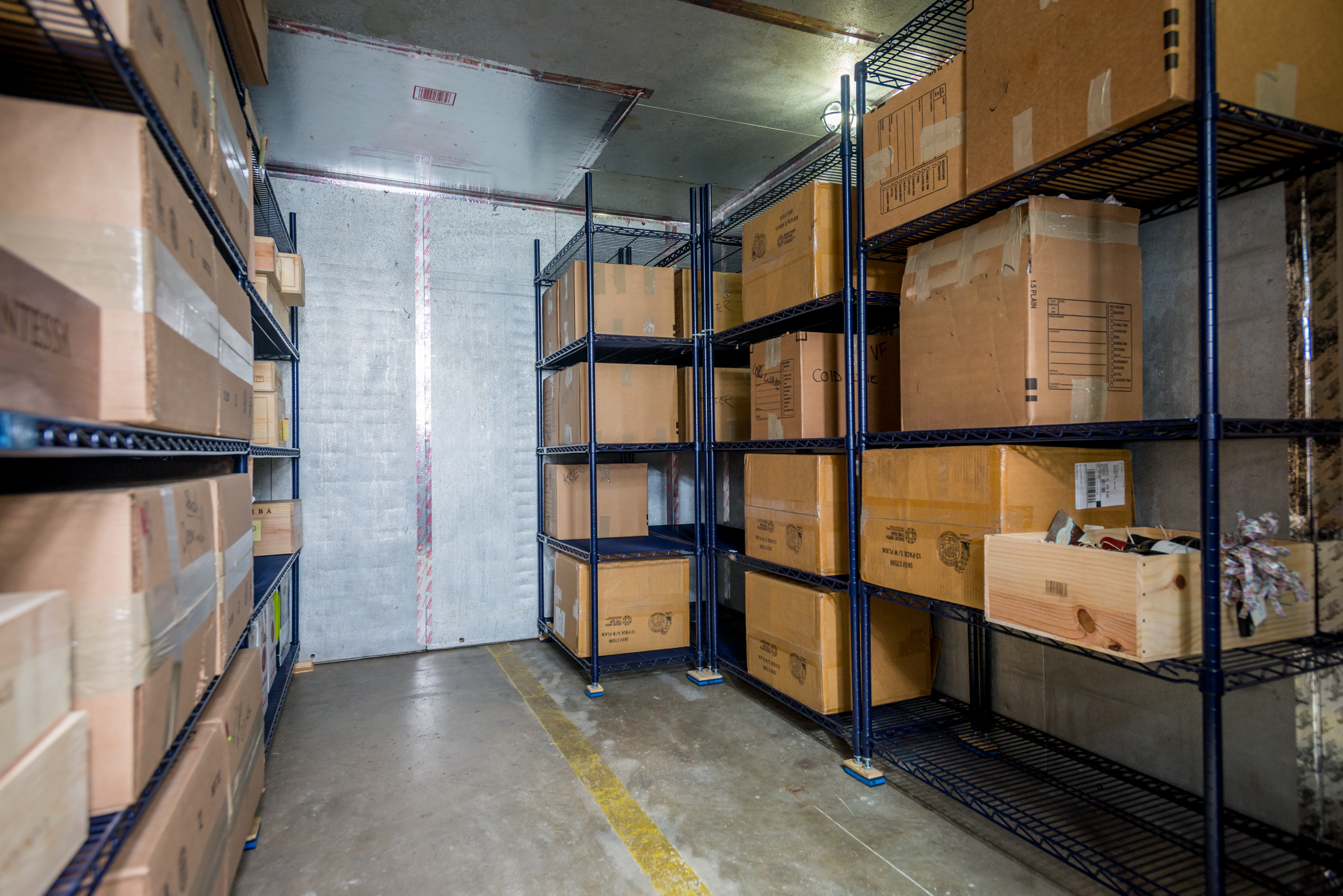 A fleet of William C. Huff moving trucks parked in a lot, showcasing residential and commercial relocation services