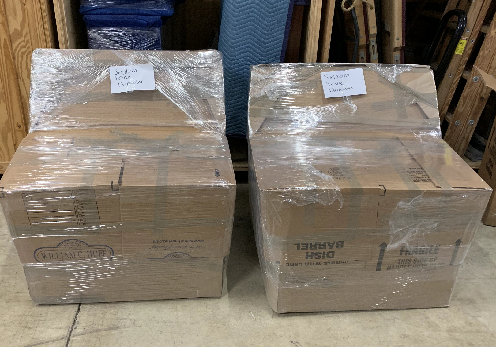 Moving boxes wrapped in plastic inside a warehouse